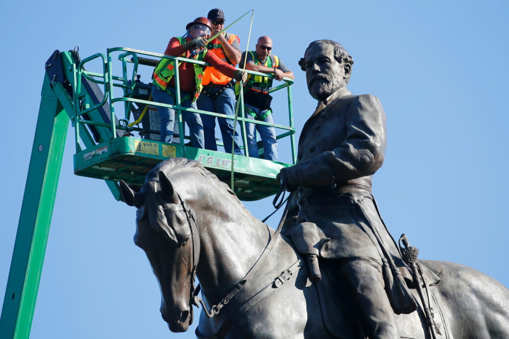 Police arrest an armed man near the Robert E. Lee Monument in Virginia