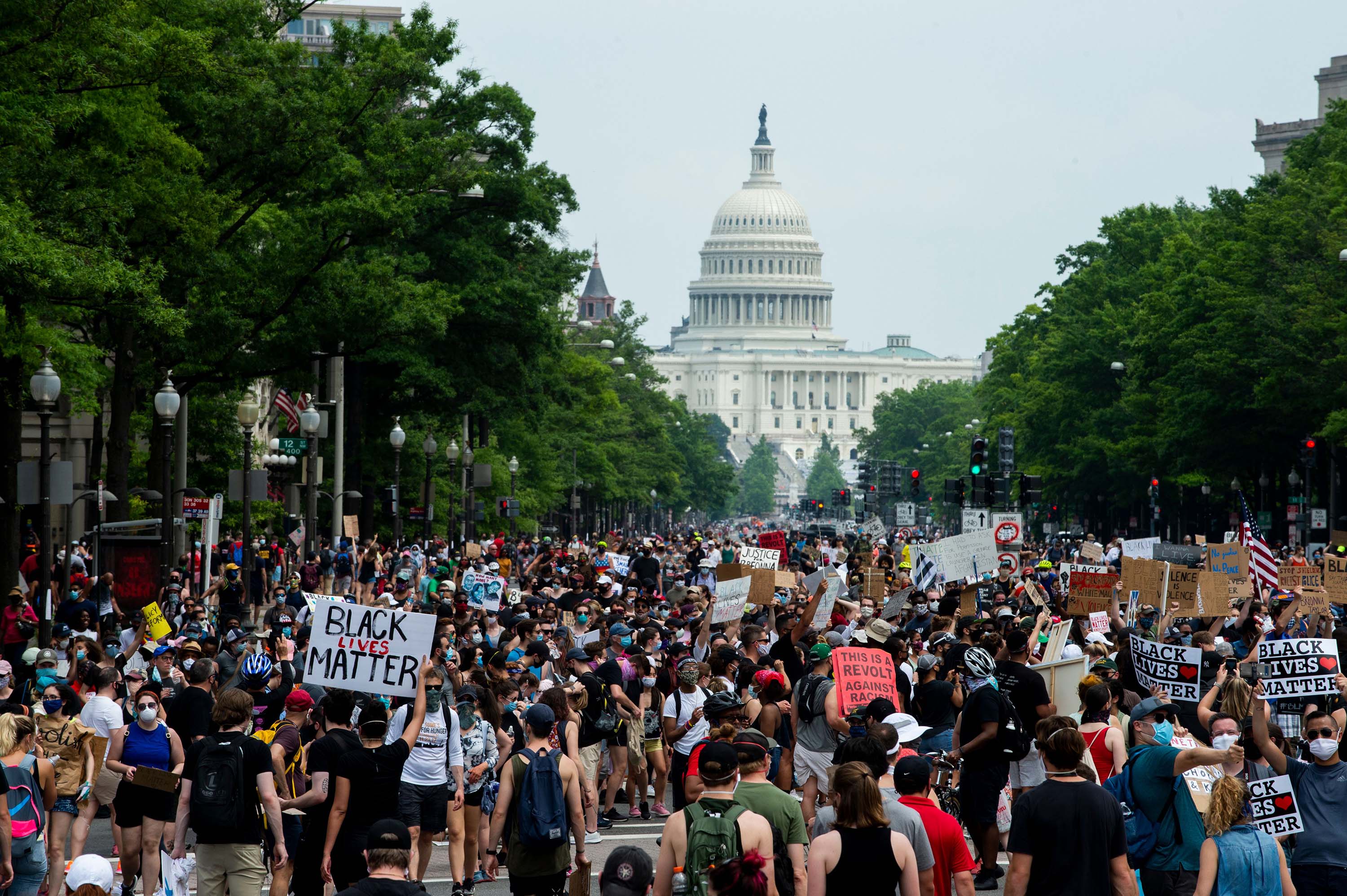 A crowd of protesters marches from the Capitol to the White House during a protest against police brutality and racism, on June 6, in Washington, DC.